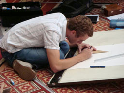 A student drafts part of his team's design.