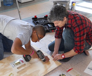 DAP participant and volunteer work together.