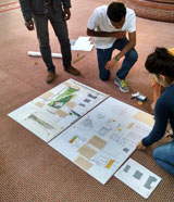 A student team works on their design boards.